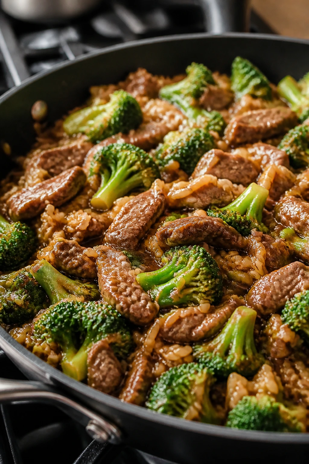 Beef and broccoli rice skillet with glossy sauce.