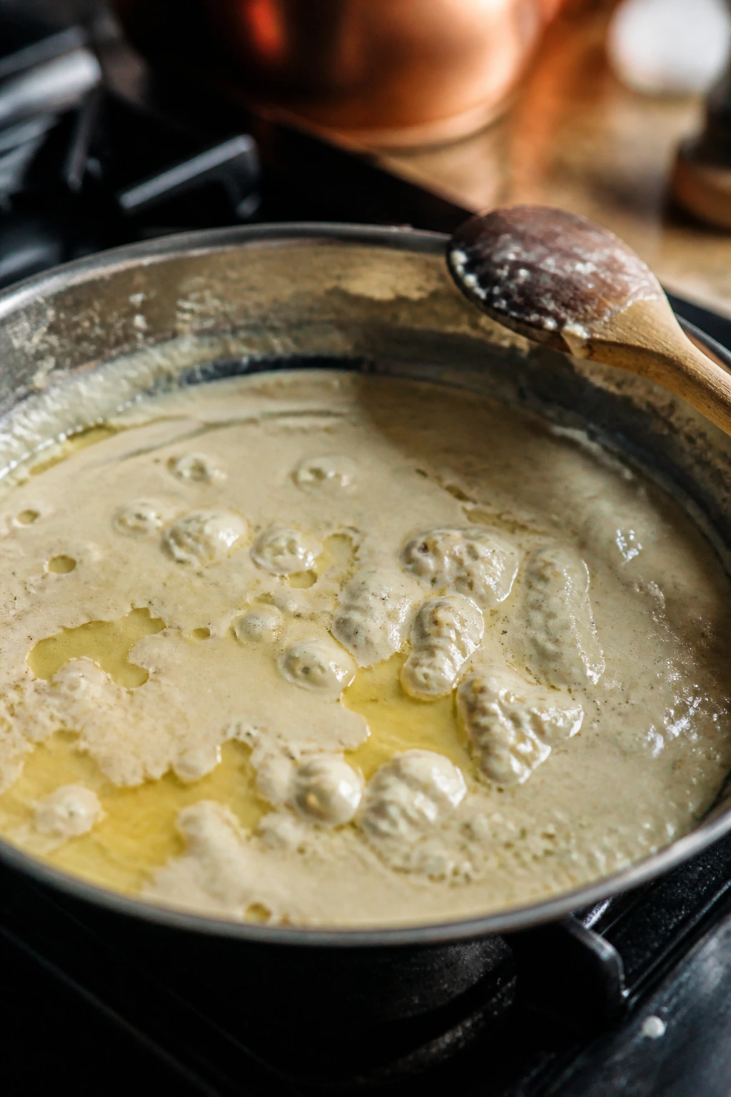 Sauce in a pan showing dairy separation as a common cooking mistake