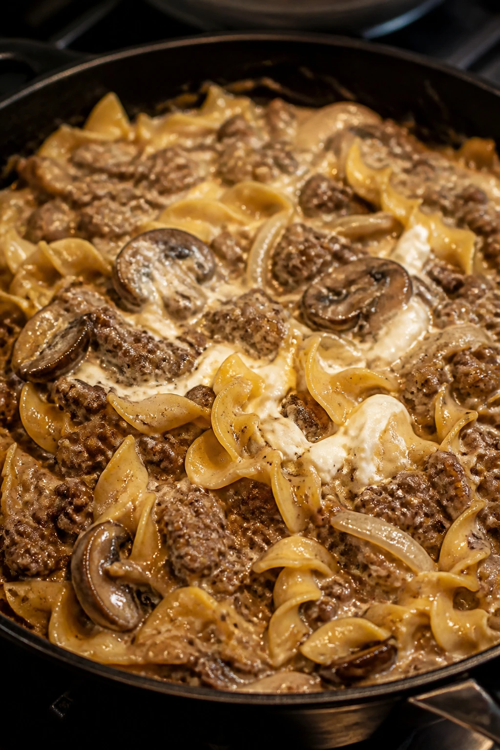 Close-up of beef stroganoff skillet with egg noodles in creamy sauce