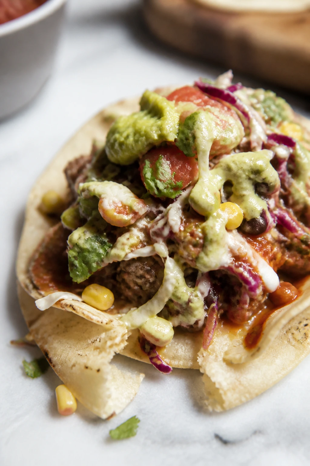 Messy street taco with overloaded toppings illustrating common mistakes