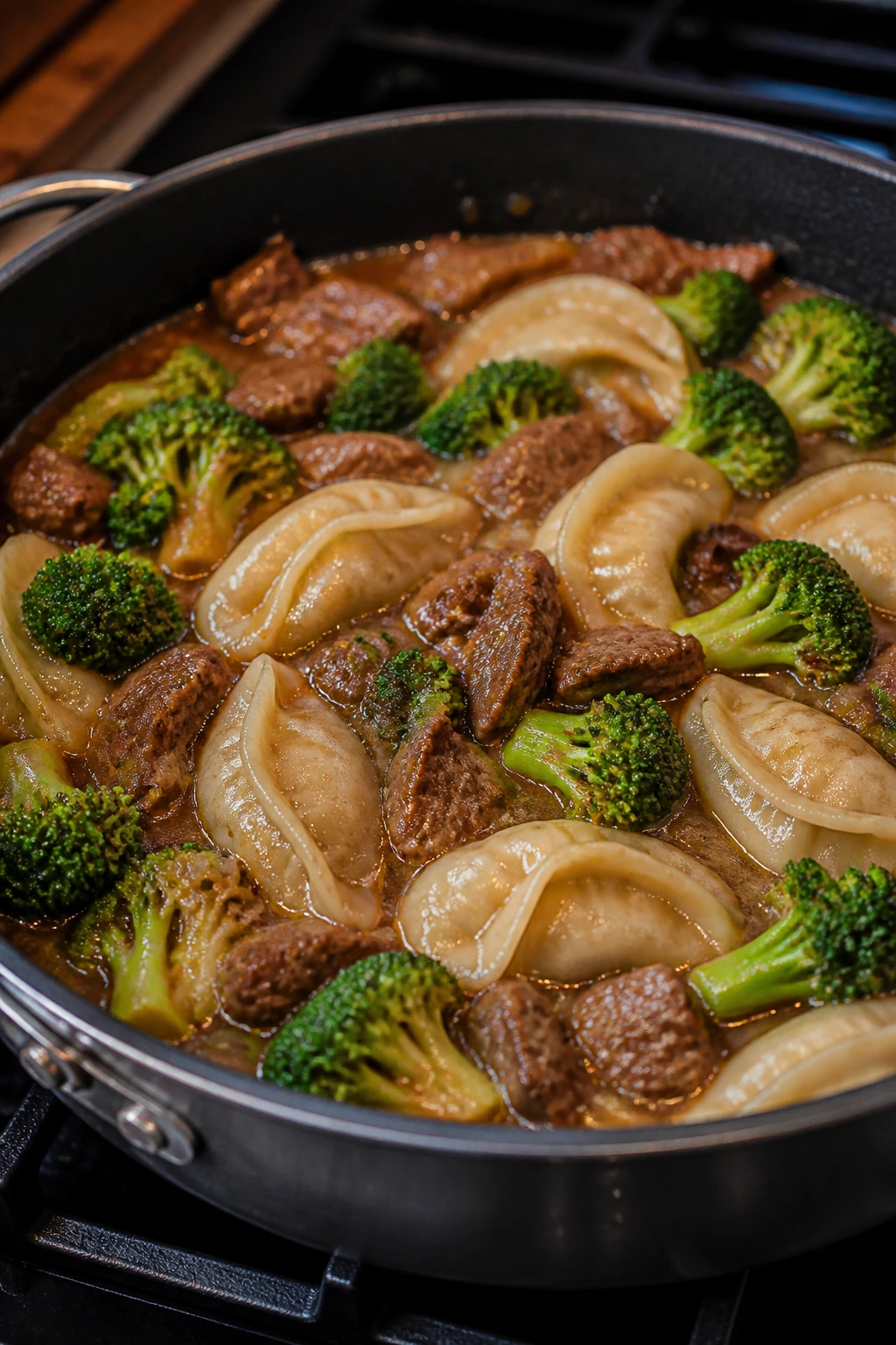 Close-up of Beef and Broccoli Dumpling Skillet with dumplings and sauce