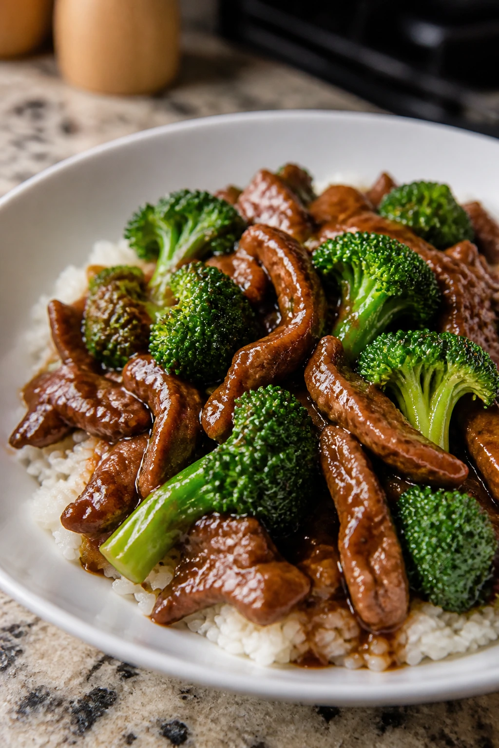 Close-up of beef and broccoli stir-fry with rice in a bowl