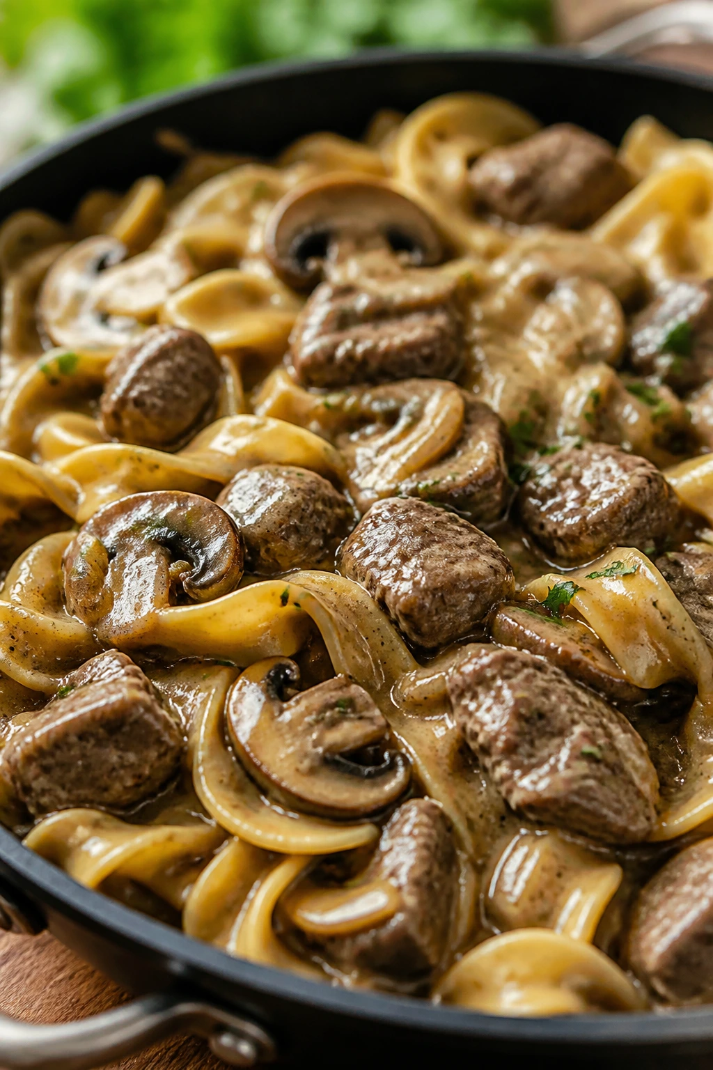 Beef Stroganoff skillet with mushrooms and egg noodles in creamy sauce