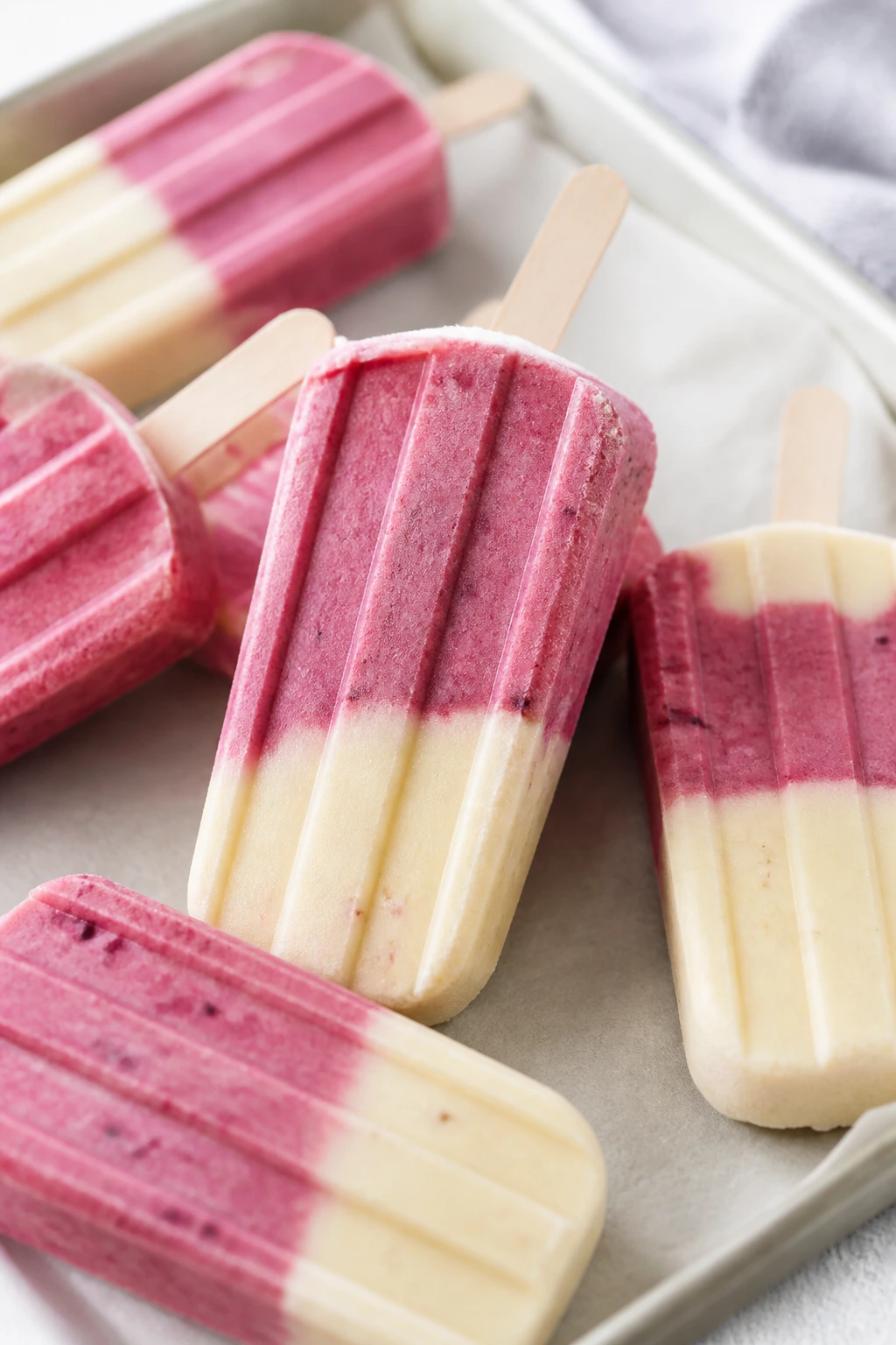 Close-up of berry banana smoothie pops on a tray