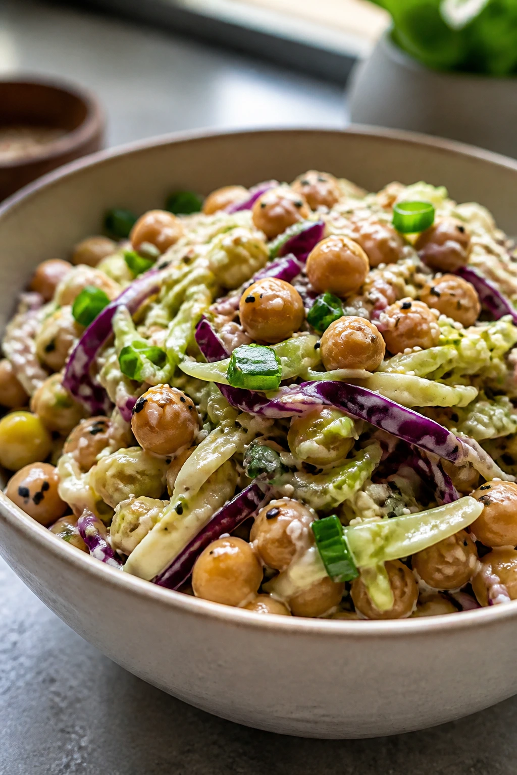 Crunchy sesame cabbage chickpea slaw in a bowl