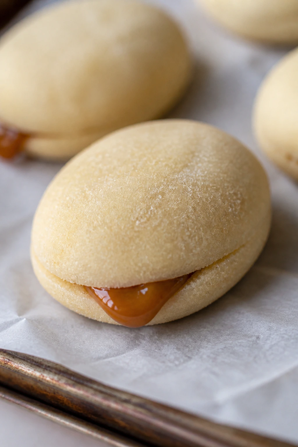 Egg-shaped shortbread with caramel filling visible at the seam