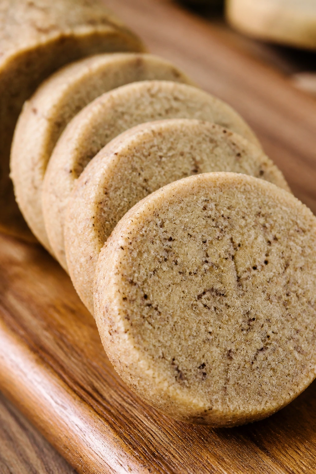 Close-up of chai-spiced slice cookies lined up on a cutting board