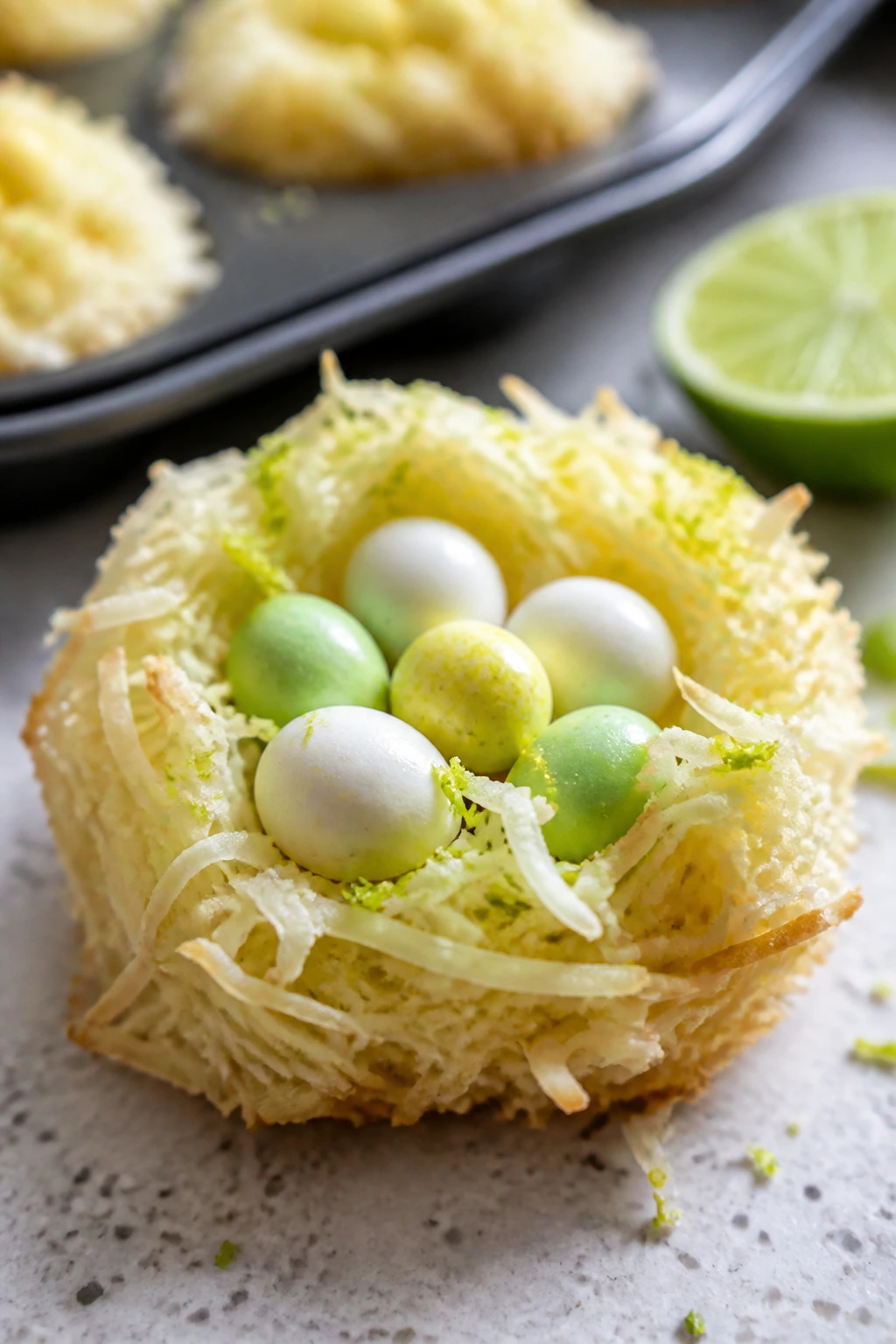 Close-up of coconut lime nest cookie with lime zest and coconut texture
