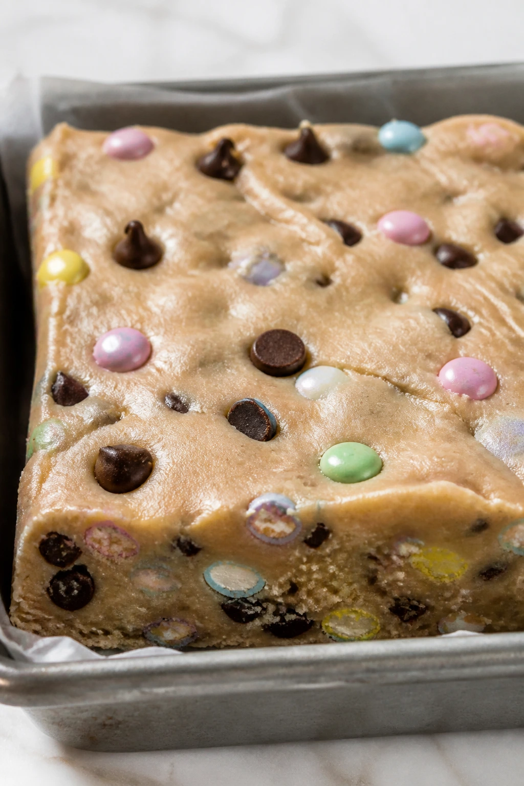 Close-up of cookie dough Easter bars in an 8x8 pan