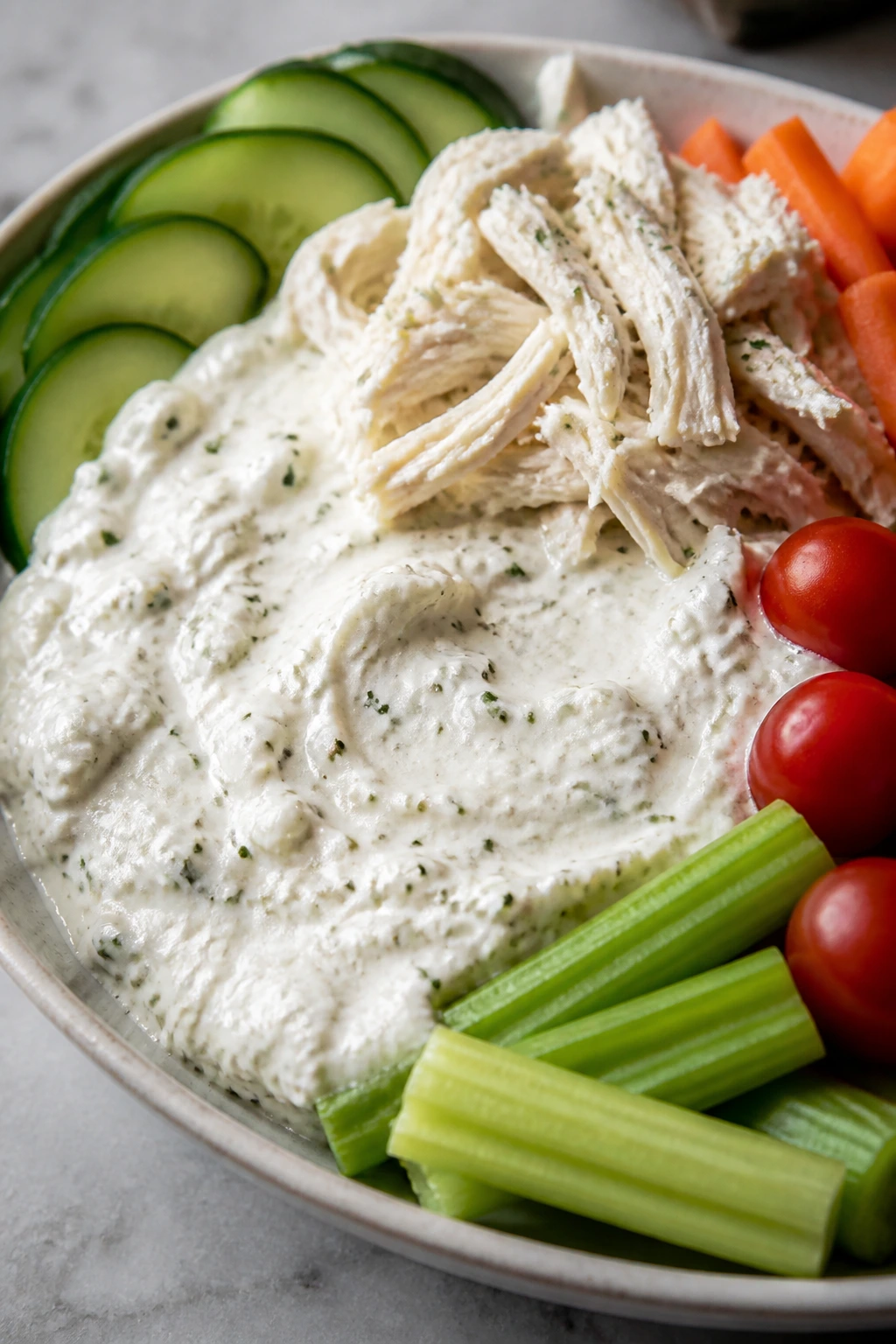 Cottage Cheese Ranch Dip with chicken and vegetables on a plate