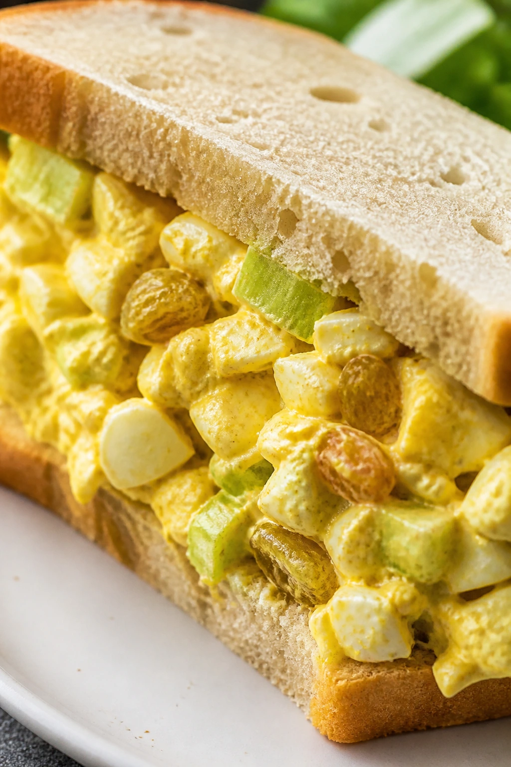 Close-up of curried egg salad sandwich on bread