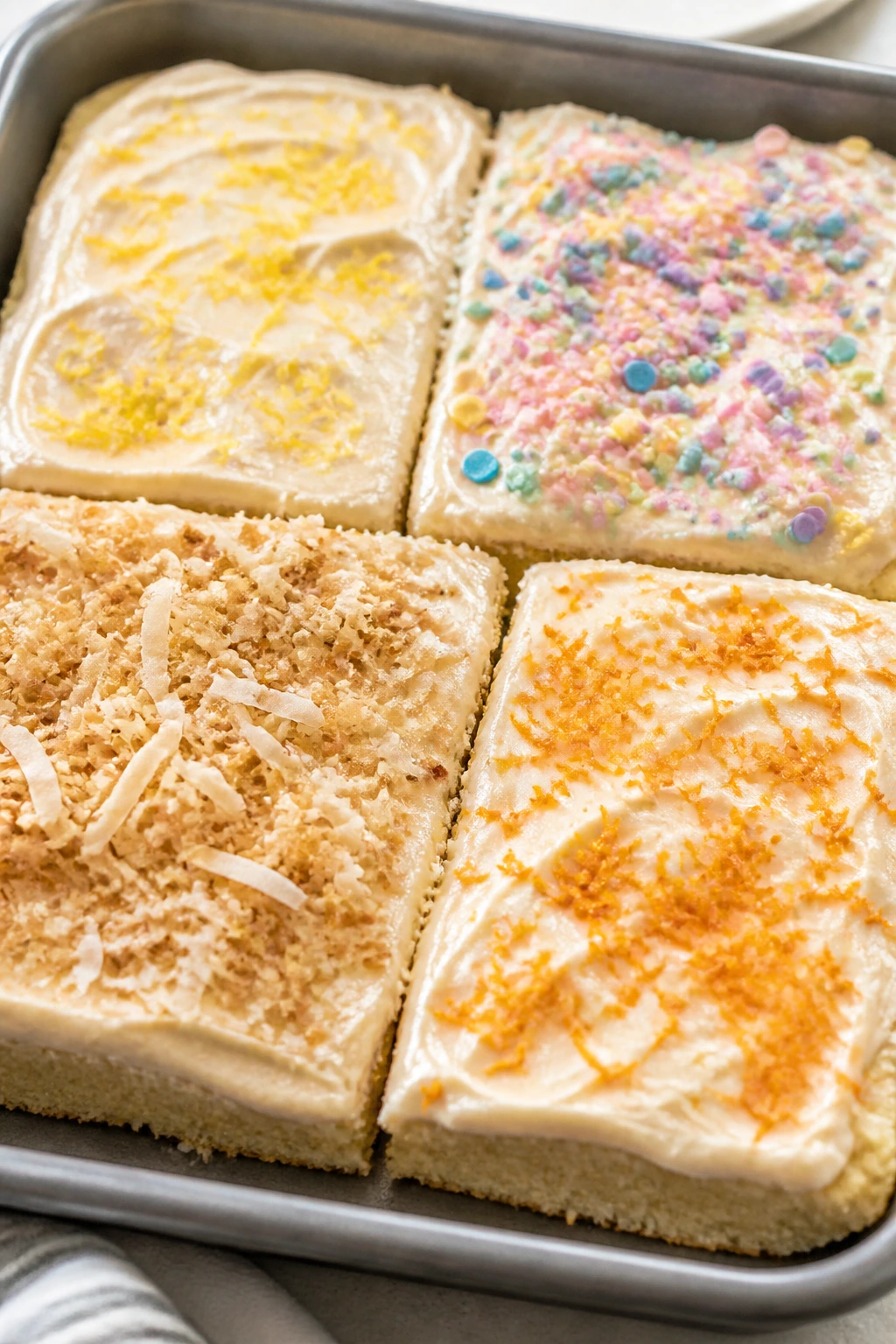 Tray of Easter sugar cookie bars with four different toppings