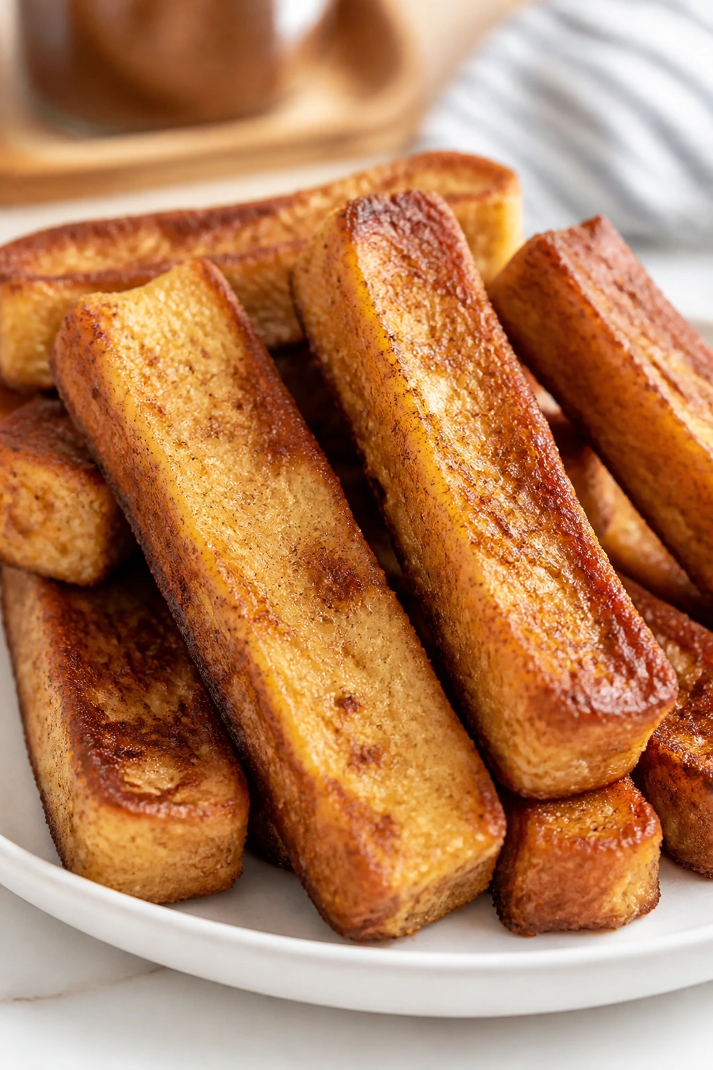 Close-up of French toast sticks stacked on a plate