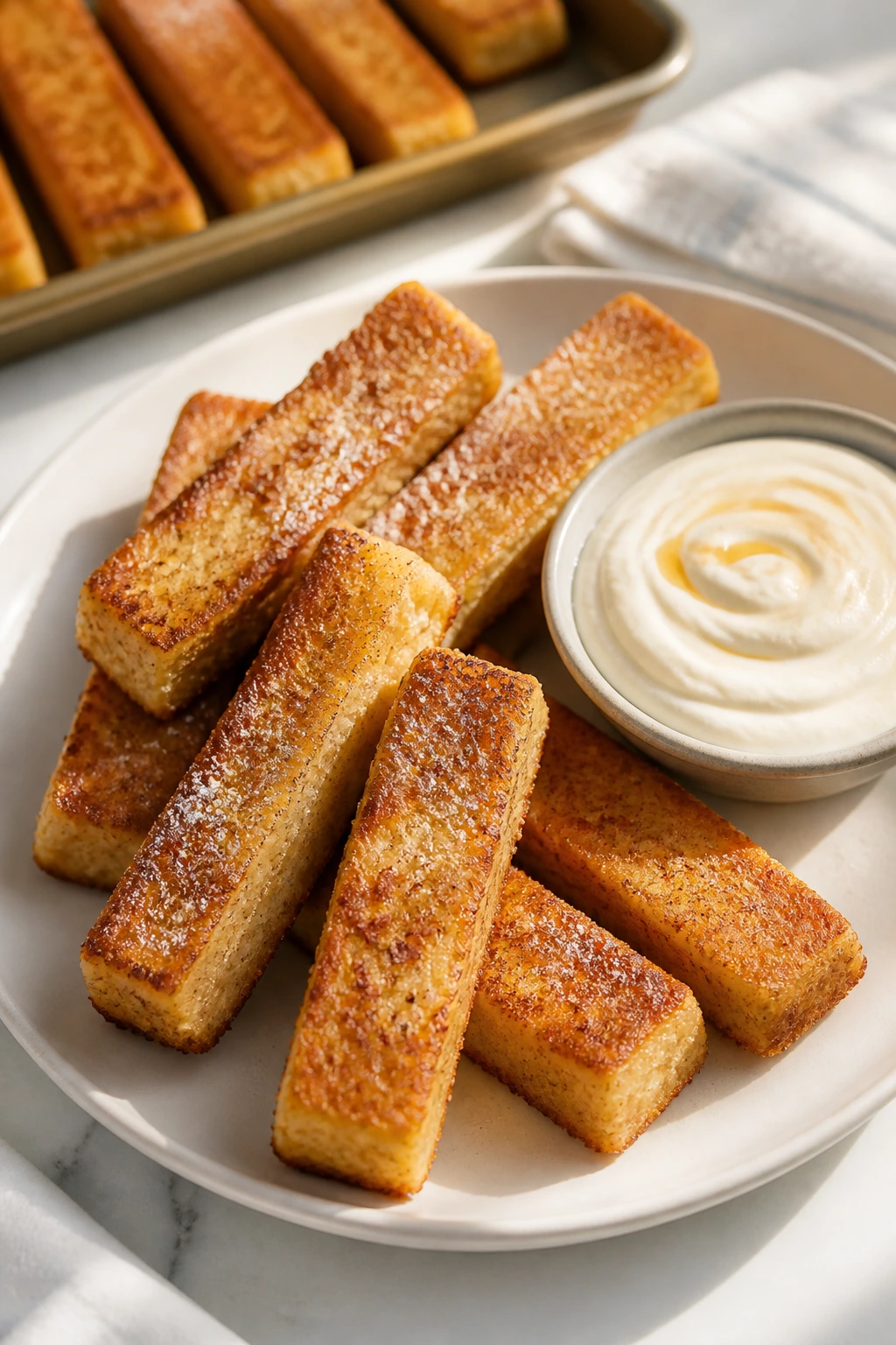 Golden baked French toast sticks with maple yogurt dip