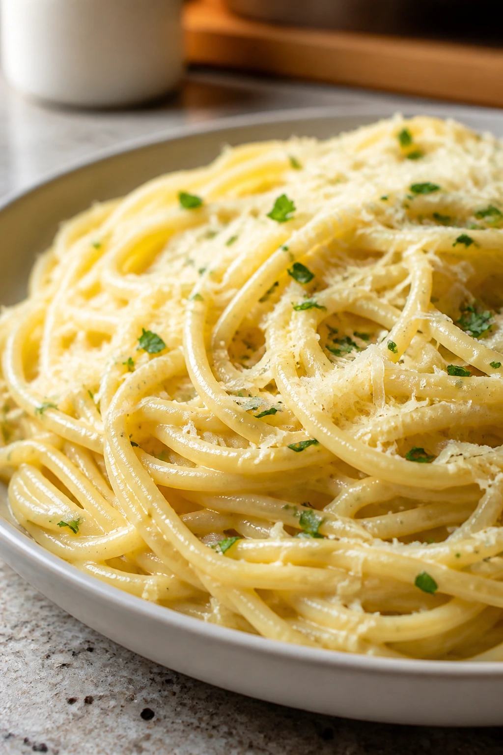 Close-up of buttery garlic parmesan noodles on a plate