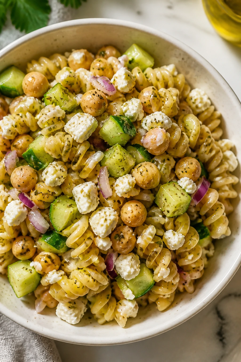 Close-up of Greek chickpea pasta in a bright bowl