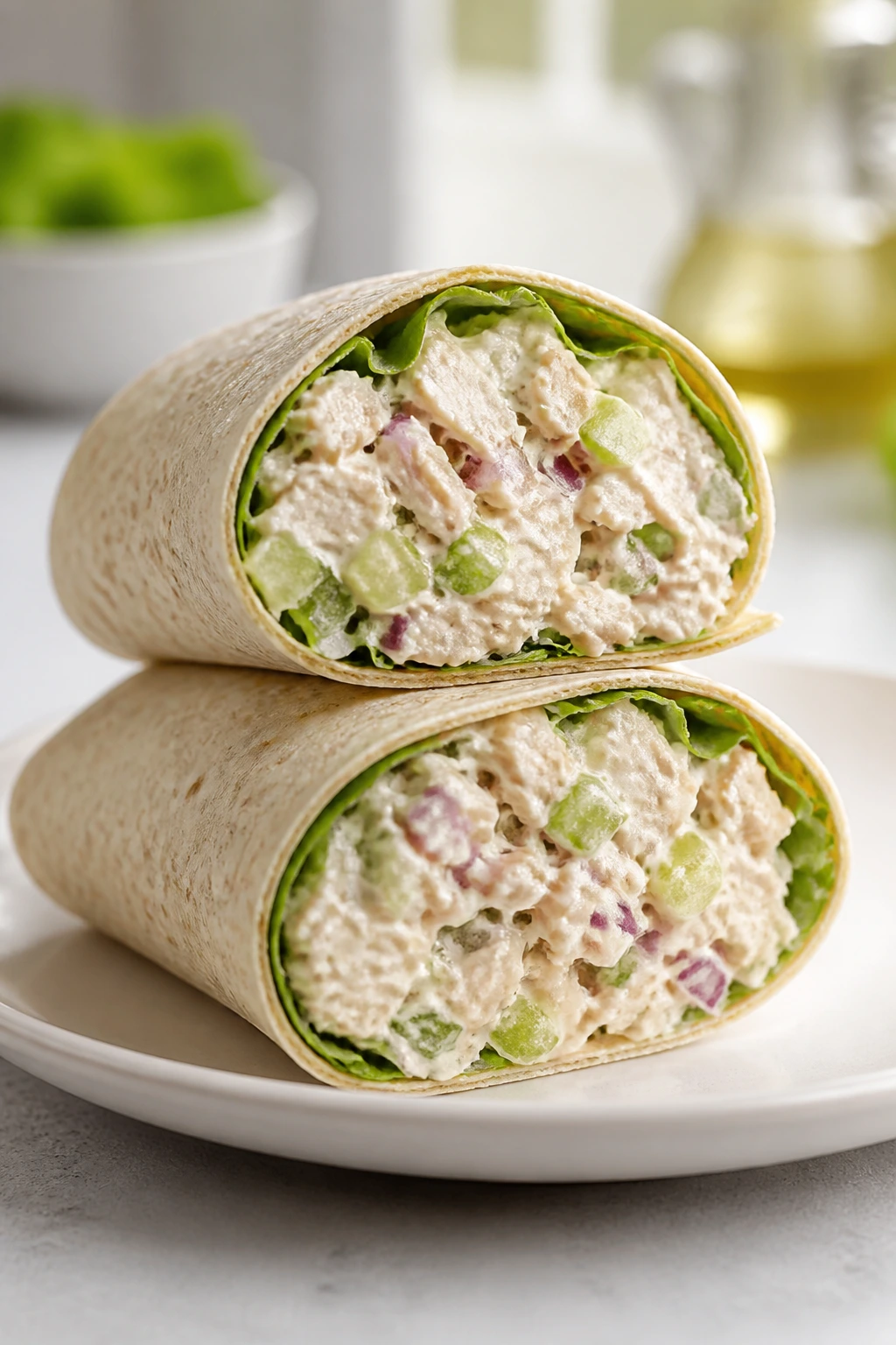 Wrap filled with Greek yogurt chicken salad on a plate