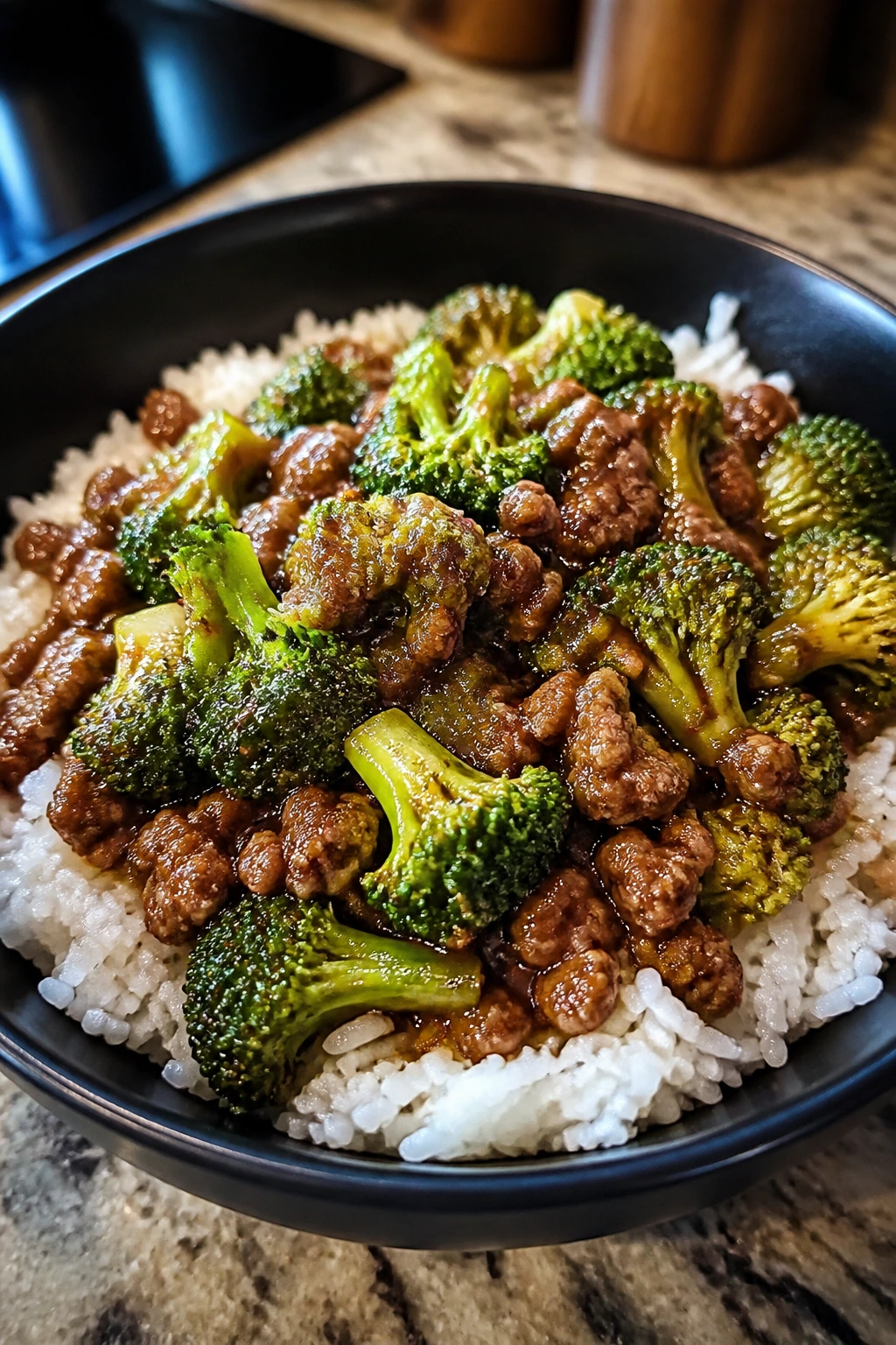 Glossy bowl of ground beef and broccoli with rice