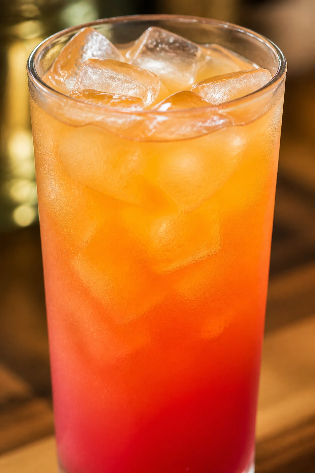 Chilled Malibu Bay Breeze in a highball glass with ice filling the frame.