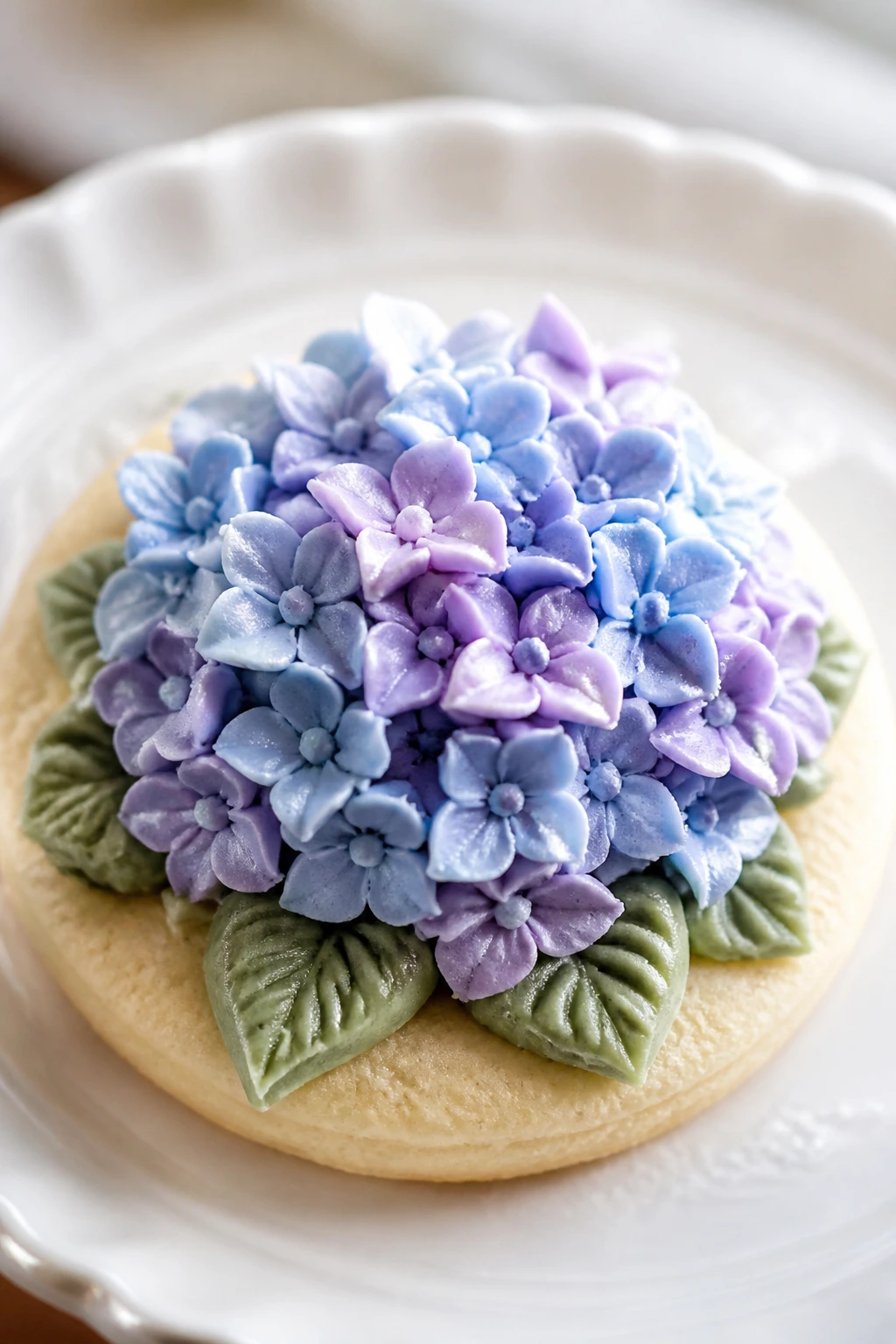 Close-up of hydrangea piped cookie on plate