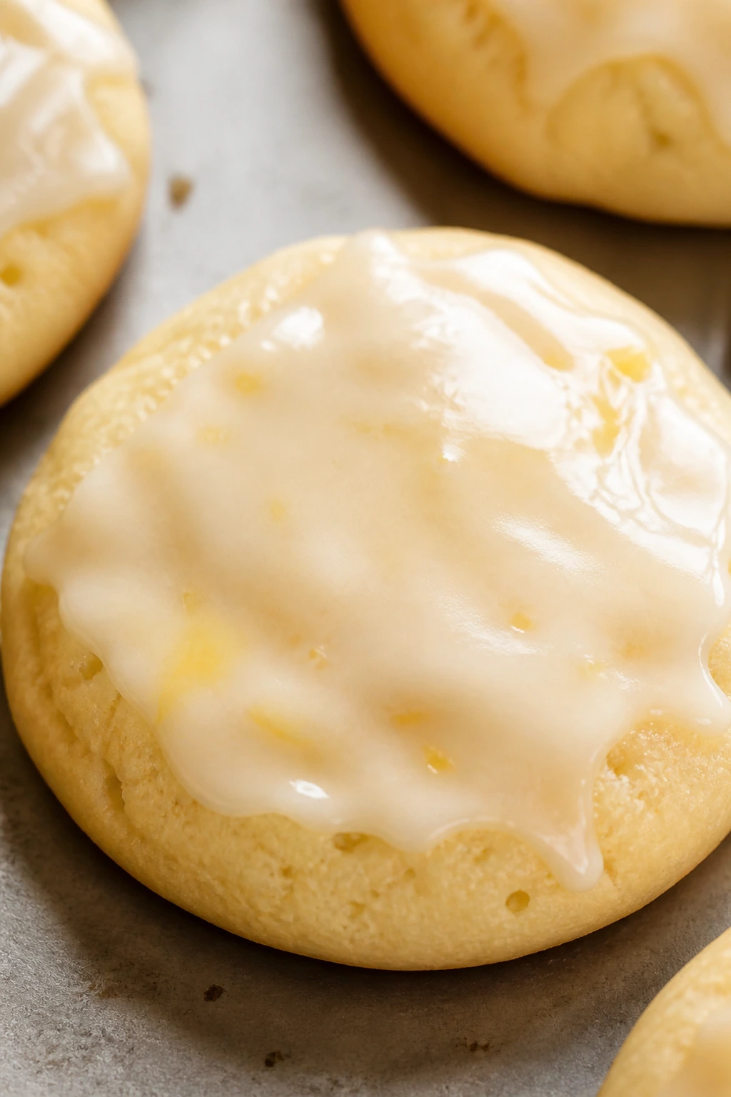 Close-up of honey ricotta cookie with lemon glaze