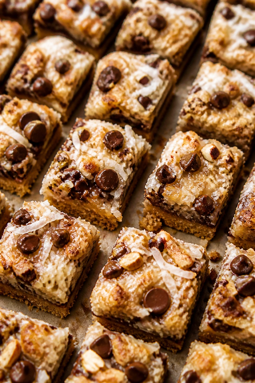Tiny squares of magic cookie bars showing layered textures