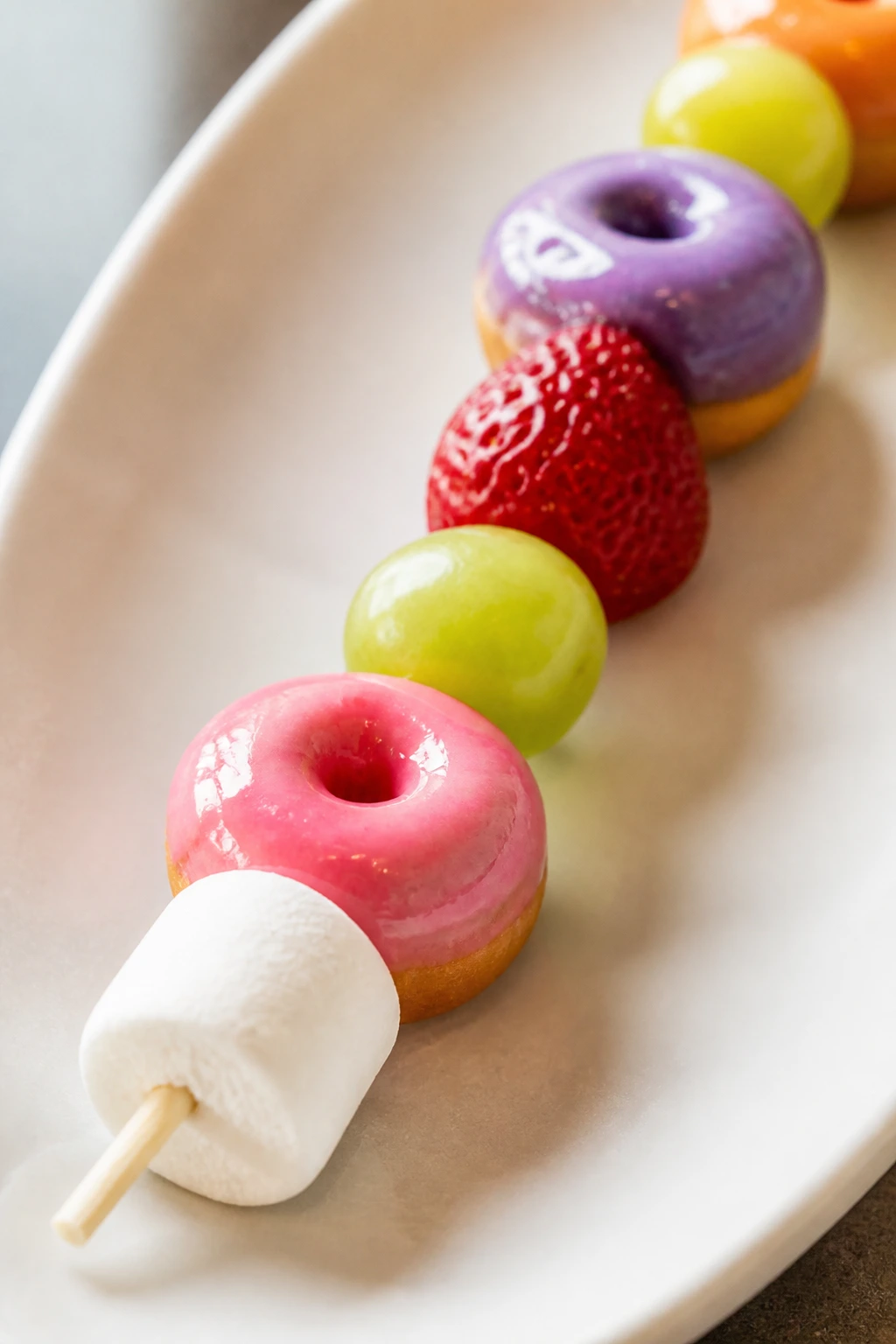 Close-up of a Mini Donut Kabob with donuts and fruit on a skewer