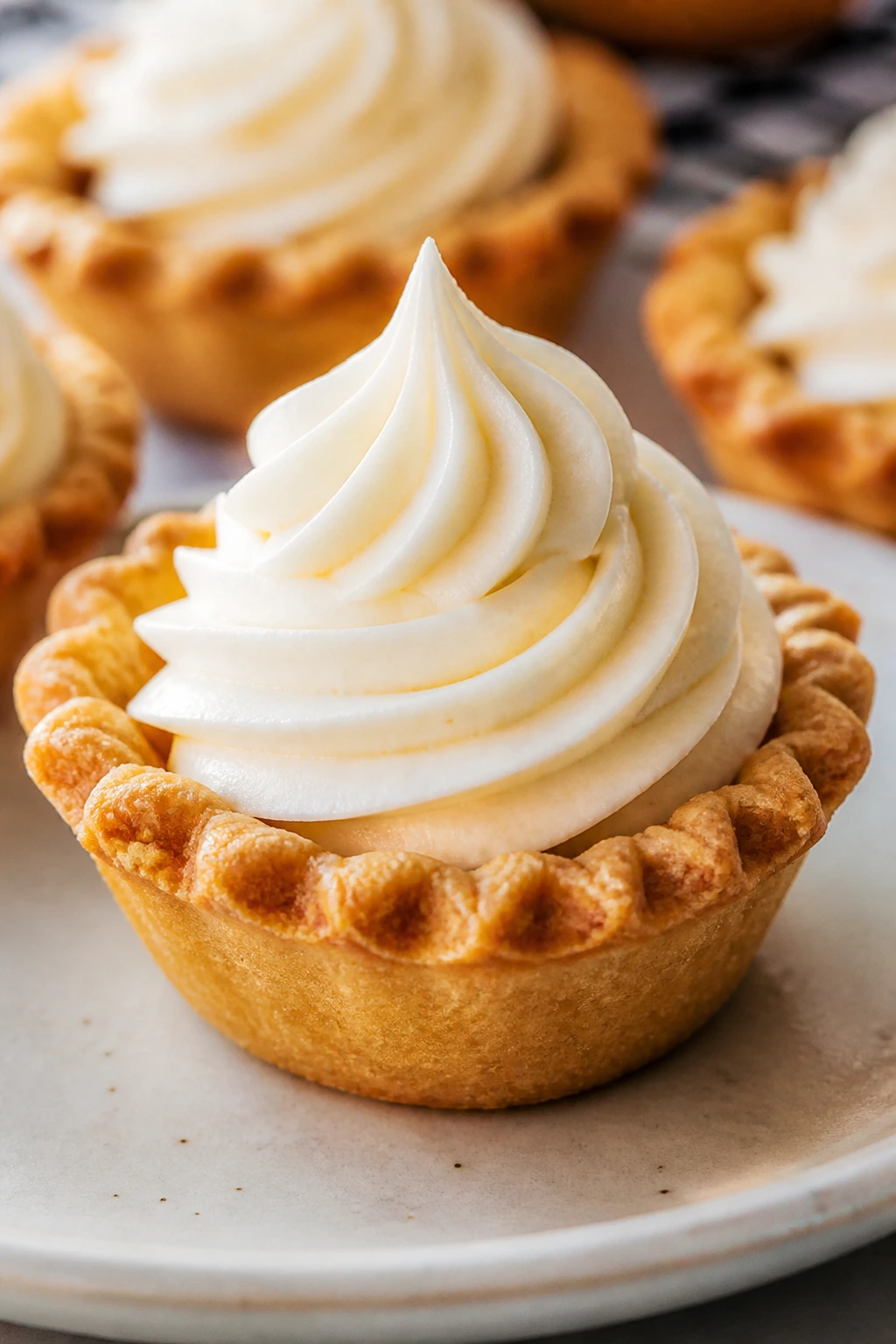 Close-up of a single frosted mini tartlet with decorative ridges