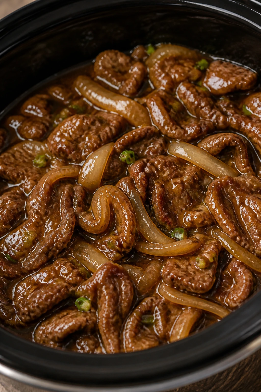 Mongolian beef in glossy sauce with onions