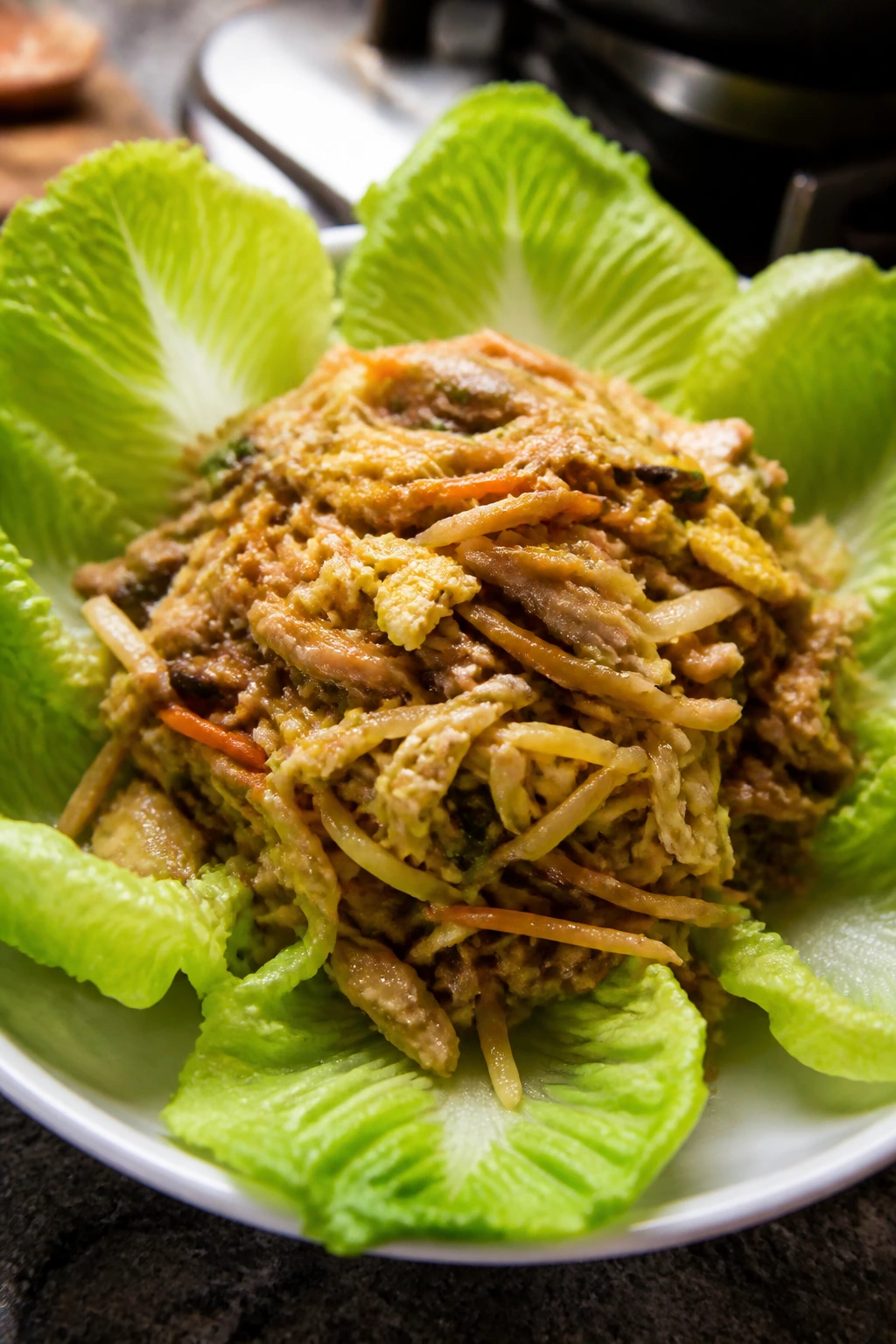 Moo Shu chicken filling in lettuce wraps on a platter