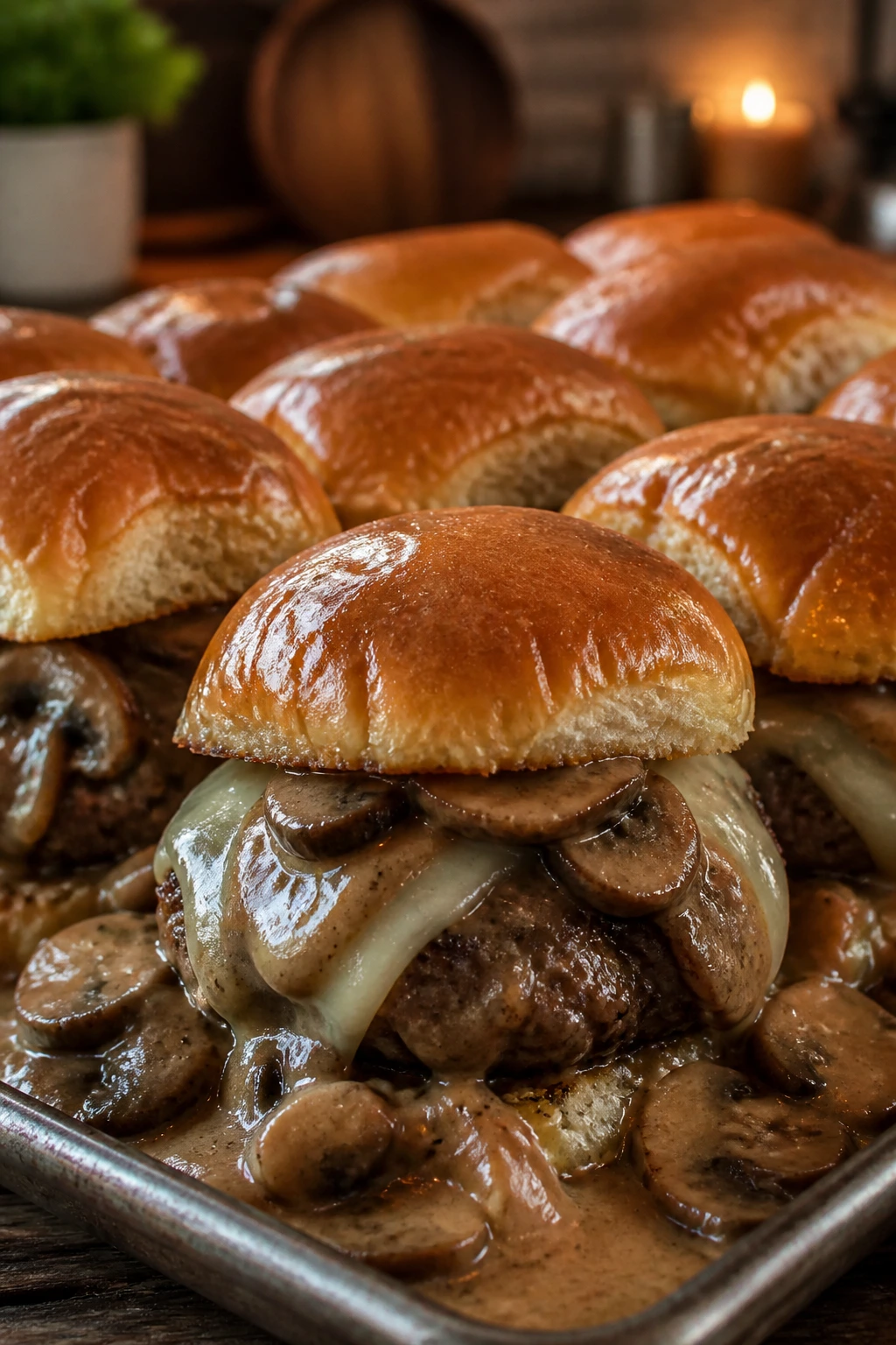 Close-up of mushroom gravy sliders with Swiss cheese and mushrooms.