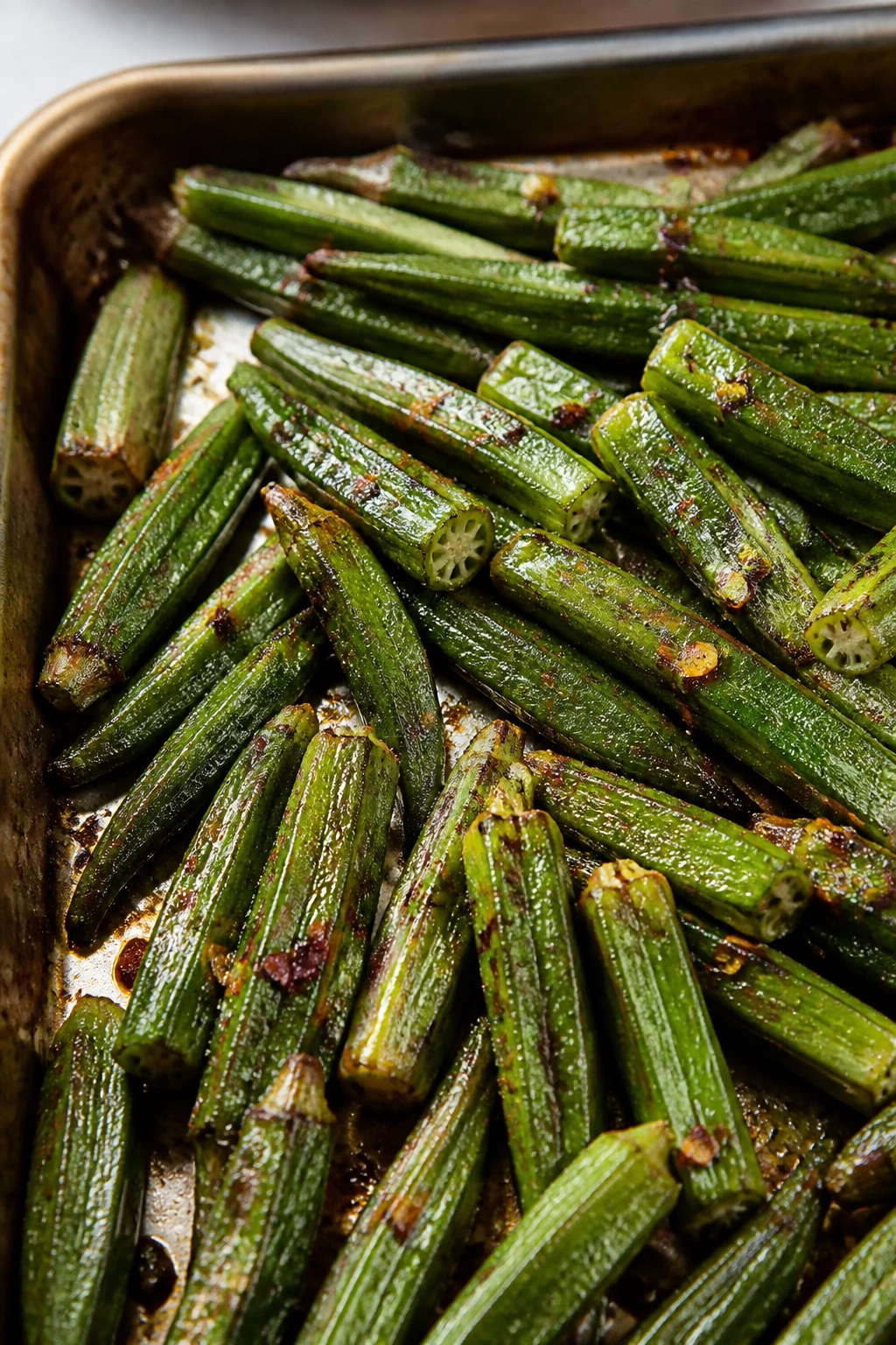 Close-up okra spears roasted to crisp edges