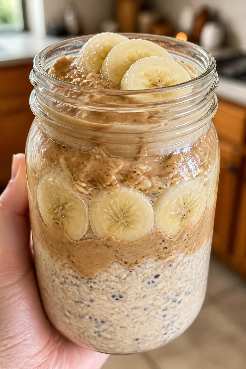 Jar of peanut butter banana overnight oats ready to eat