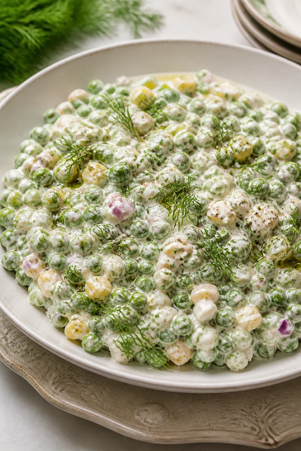 Creamy pea salad plated for serving