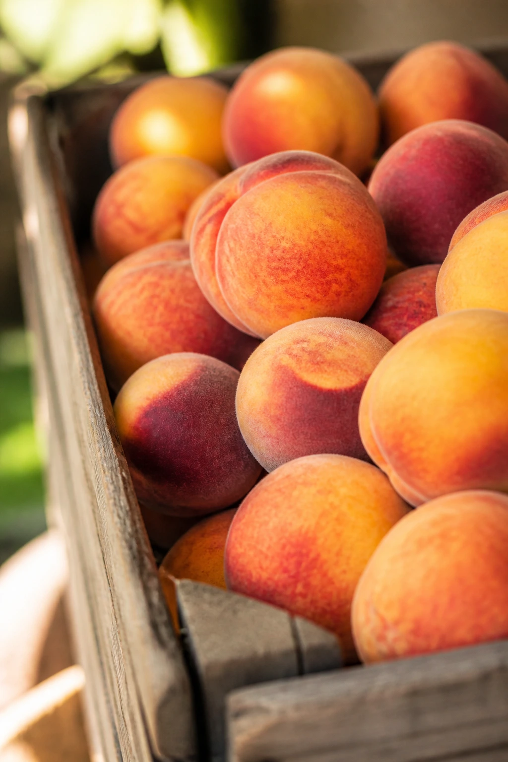 Ripe peaches in crate representing smart shopping for ingredients