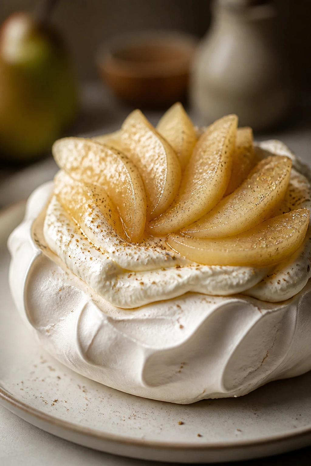 Close-up of pear cardamom pavlova with poached pears