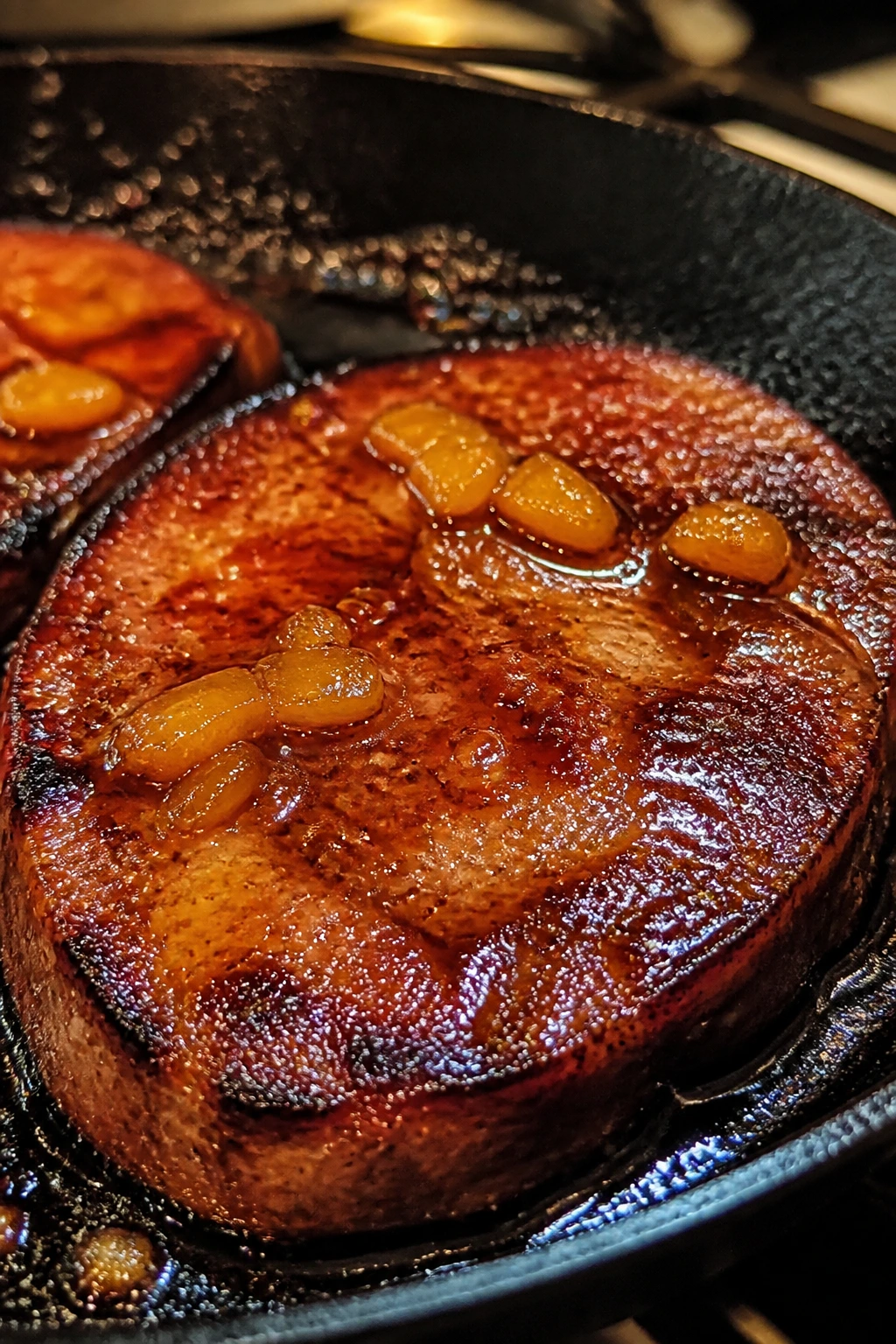 Ham steak with pineapple-chili glaze in a skillet
