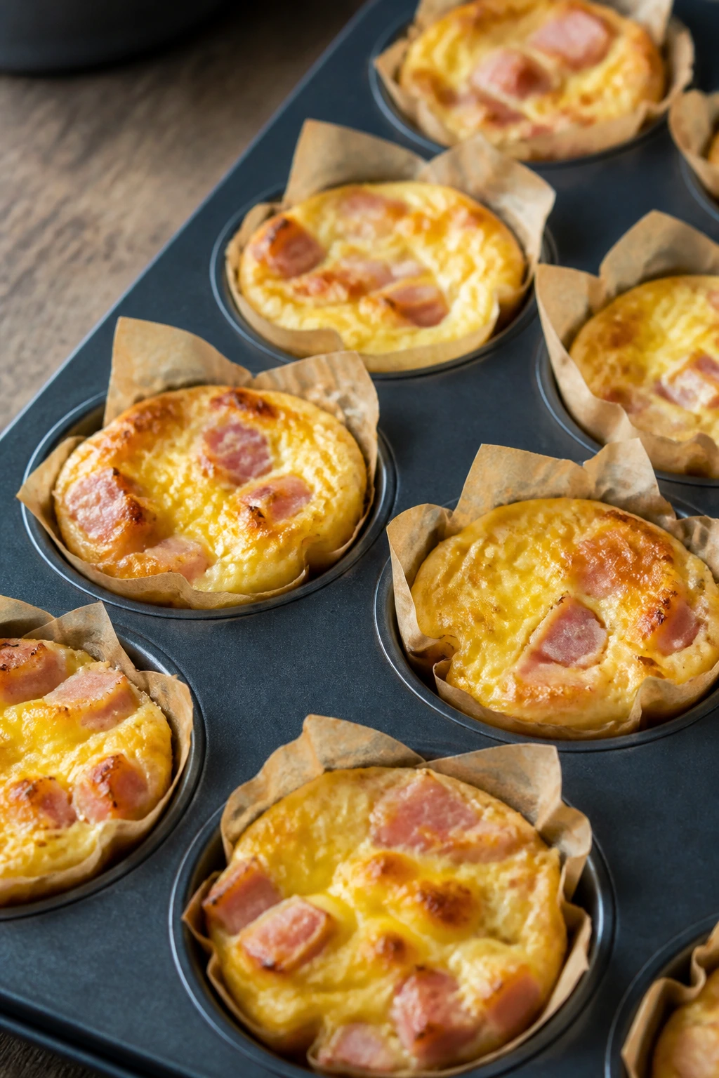 Close-up of mini ham and cheese quiches on a plate