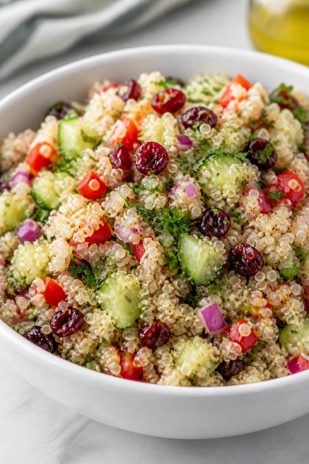 Close-up of quinoa salad showing diverse ingredients and textures