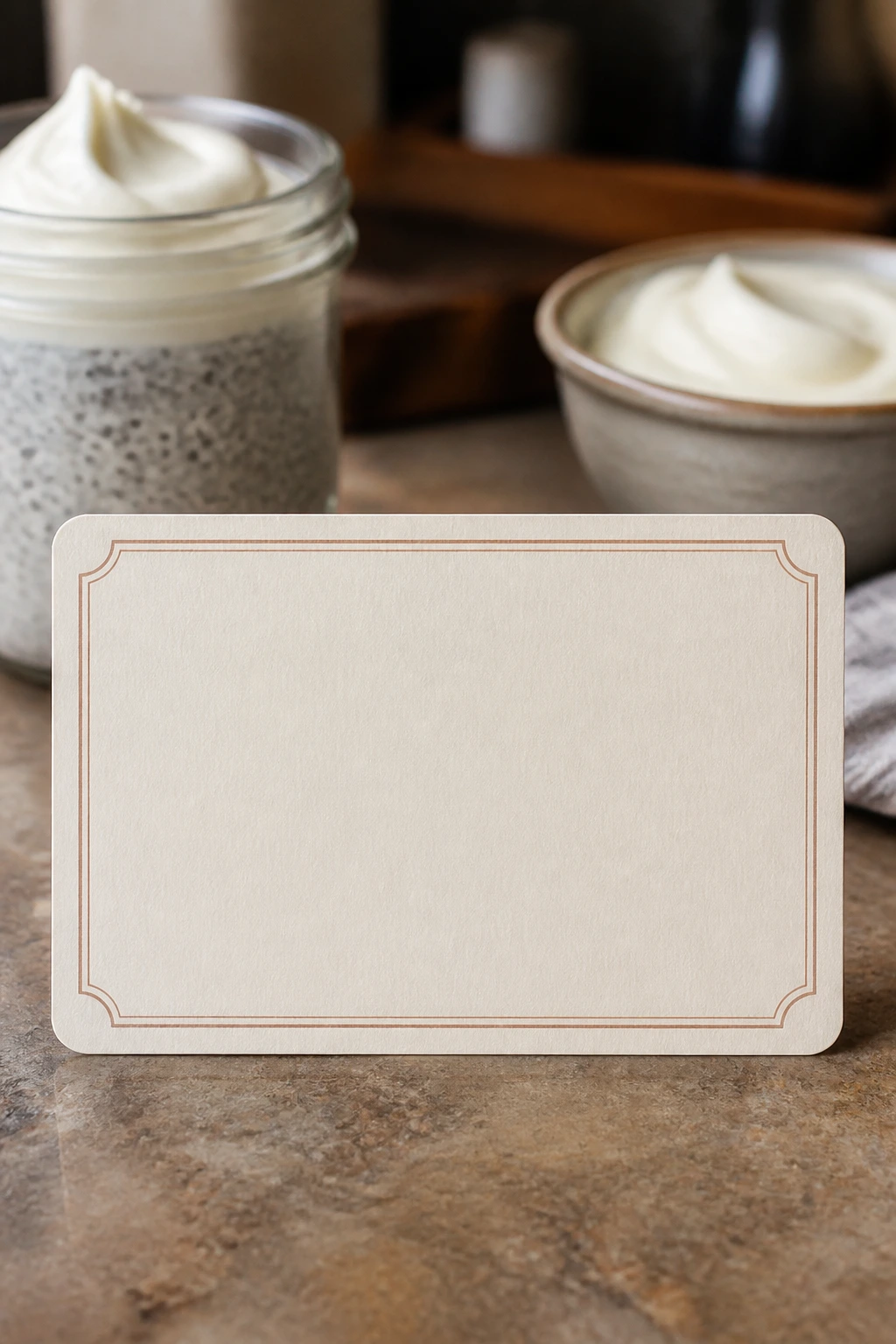 Blank recipe card on a kitchen counter with pudding in background