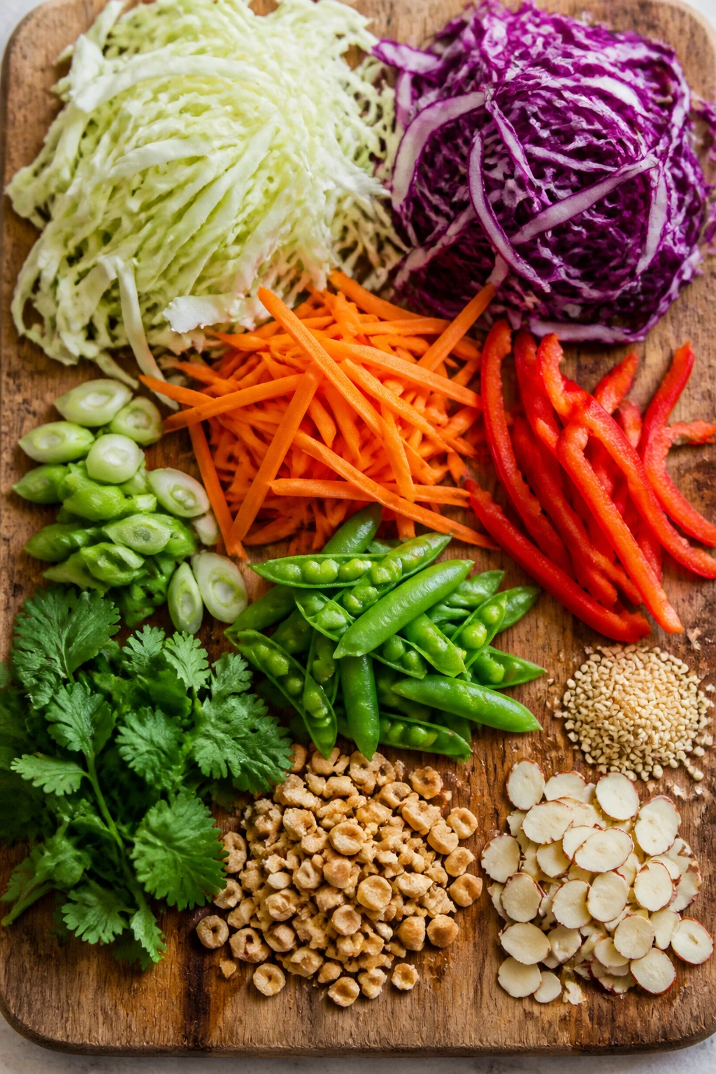 Cutting board topped with fresh slaw ingredients arranged neatly