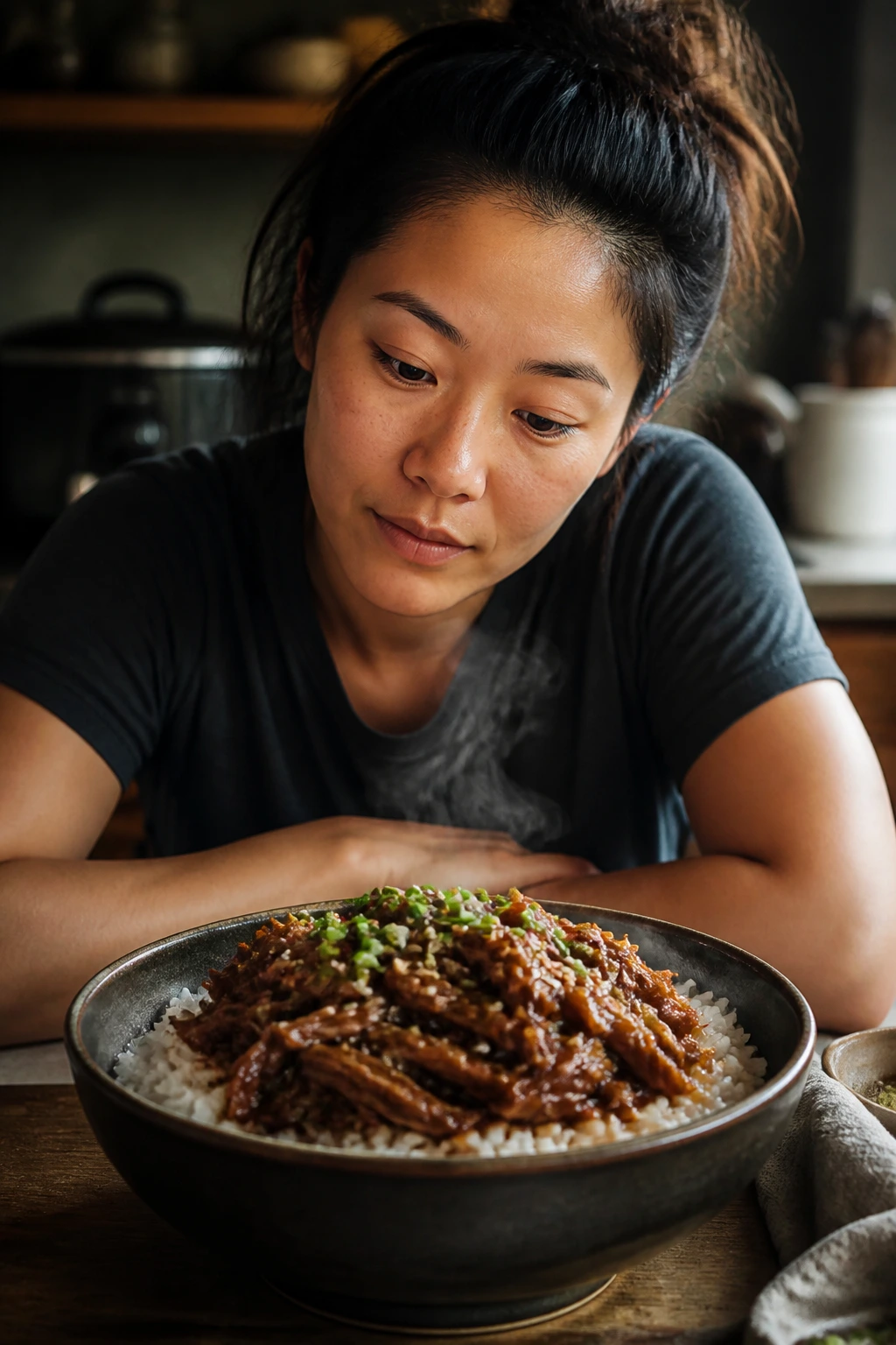 Real person in a kitchen examining a glossy slow cooker Chinese dish