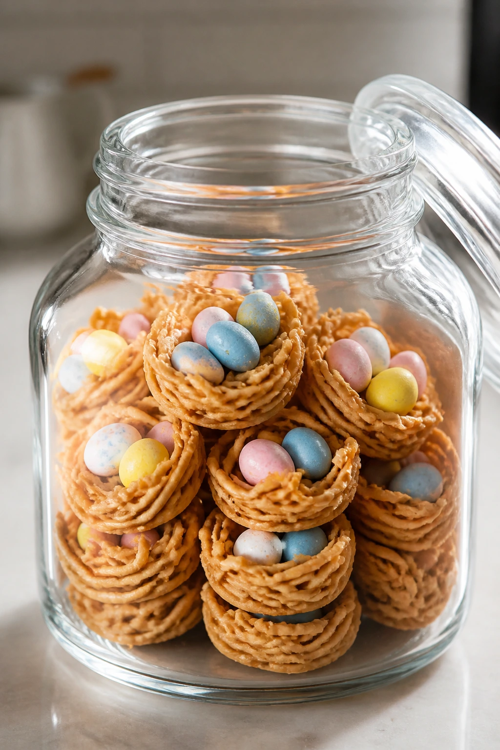 Glass jar of bird nest cookies ready for storage