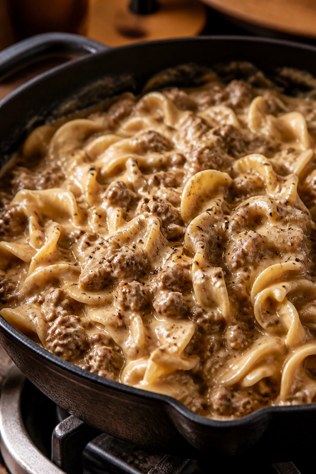 Creamy hamburger stroganoff with egg noodles in a skillet