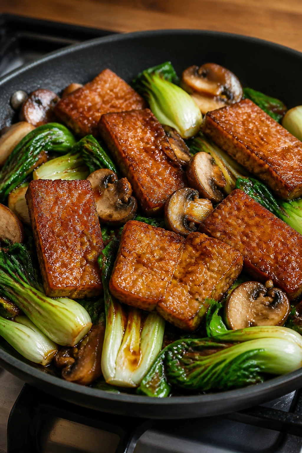 Tempeh with bok choy and mushrooms in miso-ginger glaze