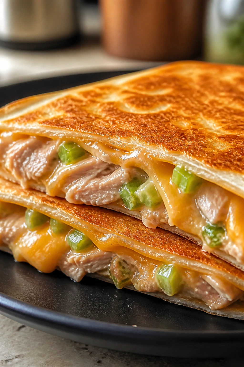 Quesadilla wedge with melted cheese and tuna