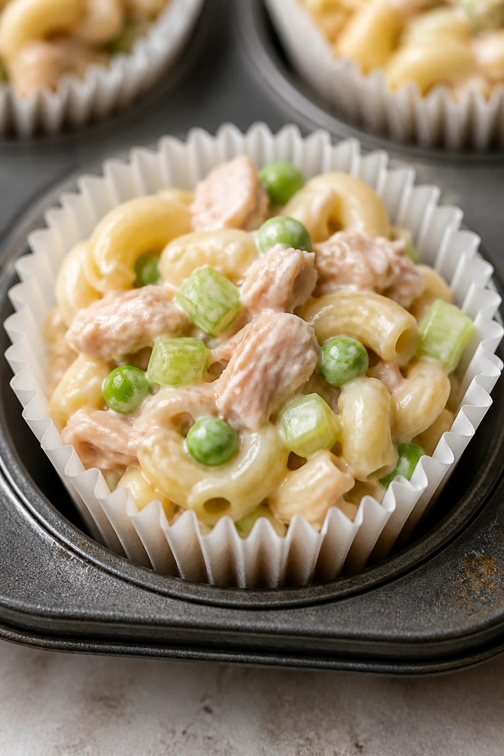 Close-up of tuna pasta salad cup in muffin cup
