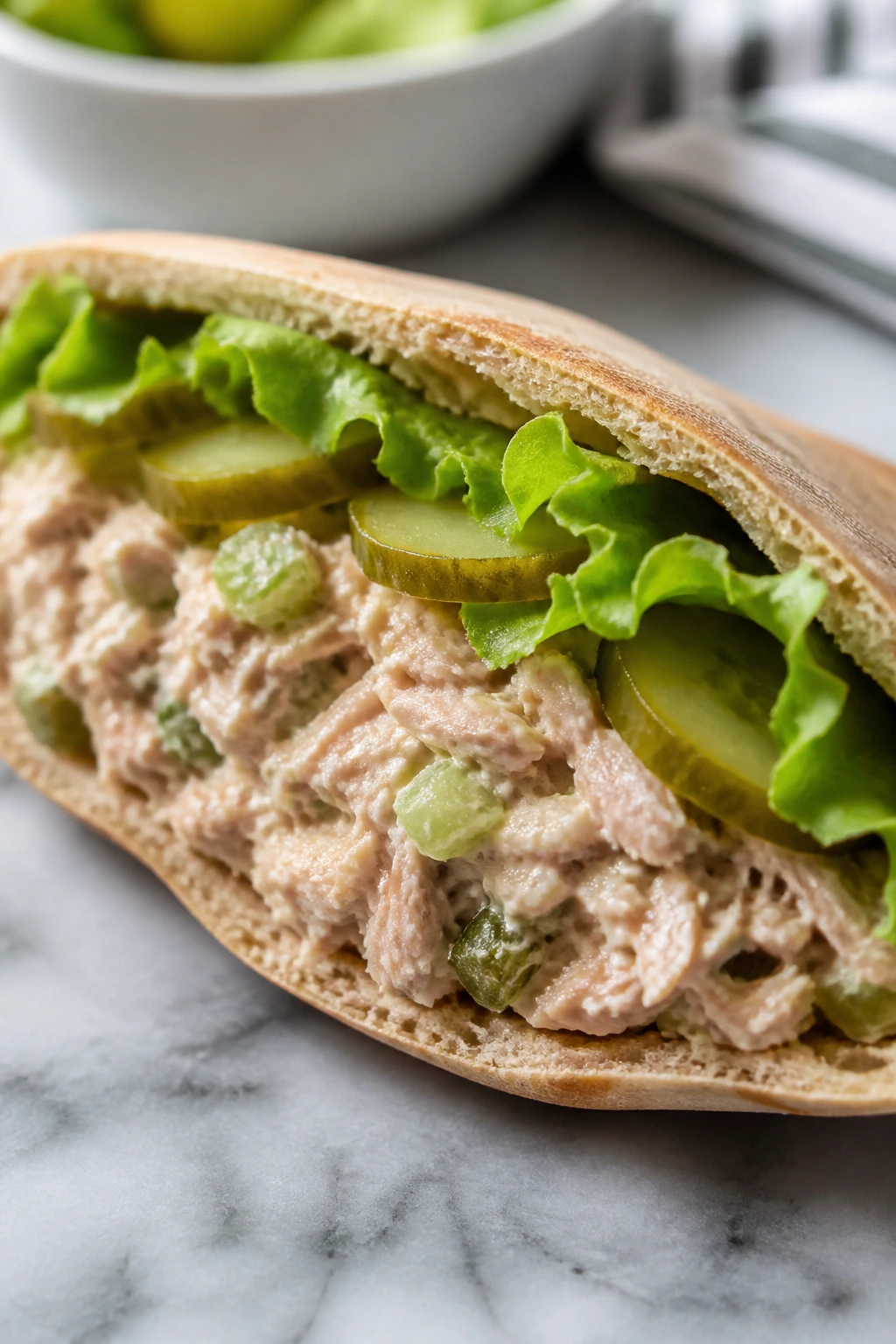 Split pita with tuna salad filling and lettuce