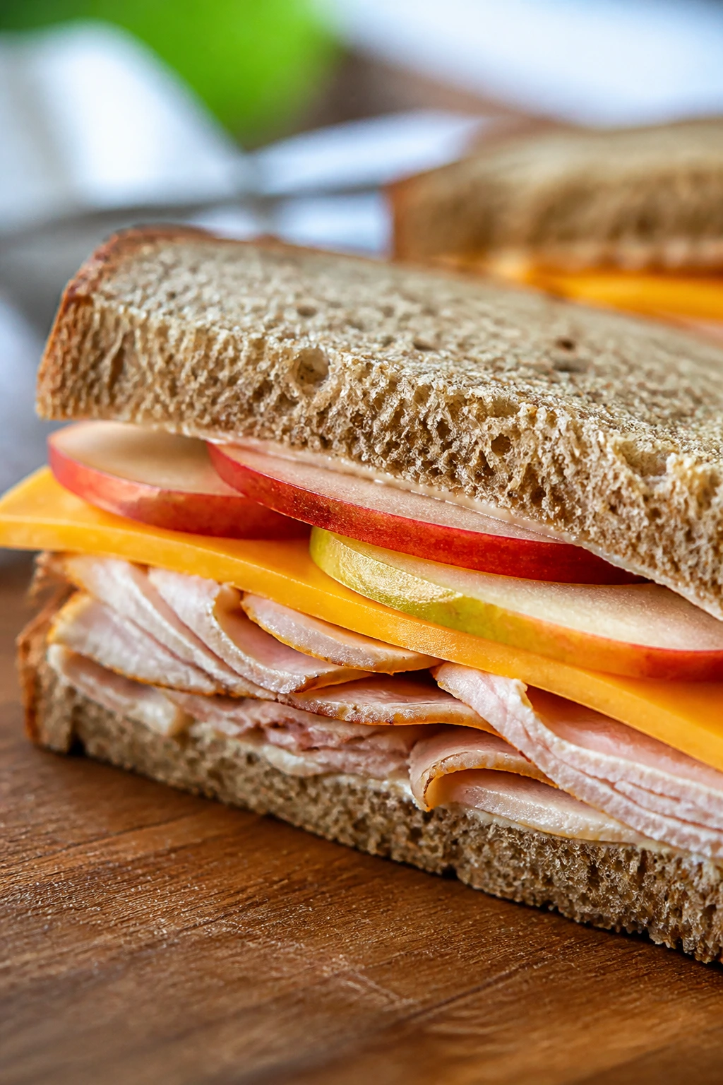 Half sandwich with turkey, cheddar, and apple slices on whole wheat