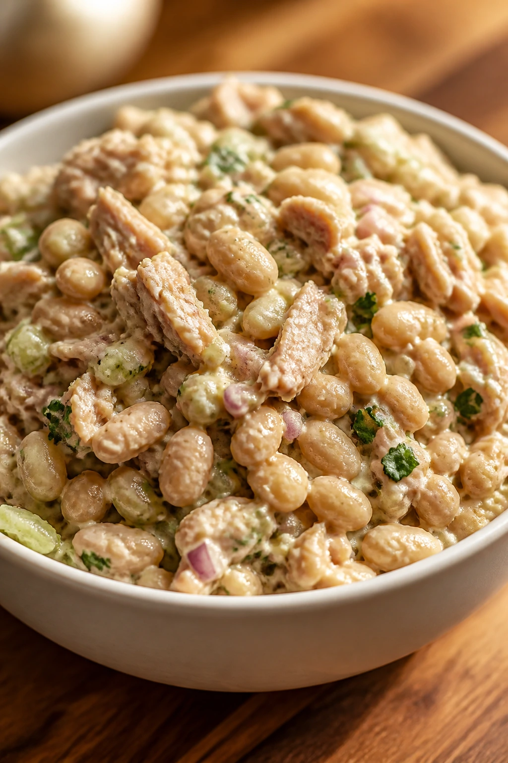 Close-up of white bean tuna salad in a bowl with beans and tuna